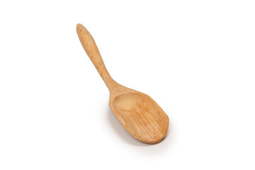Wooden spatula for spices, tea isolated on a white background.