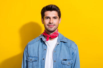 Photo portrait of attractive young man look camera dressed stylish denim clothes isolated on yellow color background