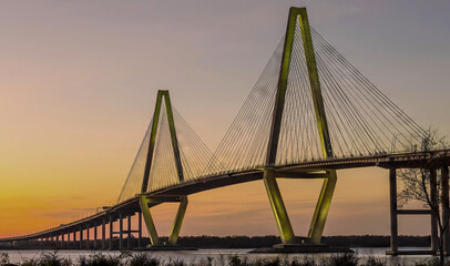 Obraz premium bridge over a river at sunset