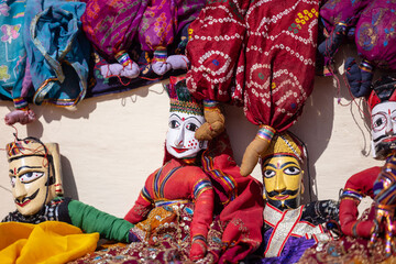 Indian colorful Rajasthani handmade Puppets and Crafts products at jodhpur. Selective focus.
