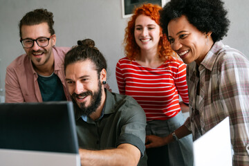 Mixed team of software engineers brainstorming ideas. Diverse app developers collaborating as group