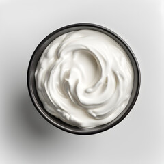 Top view of isolated bowl of sour cream or Greek yoghurt on white background