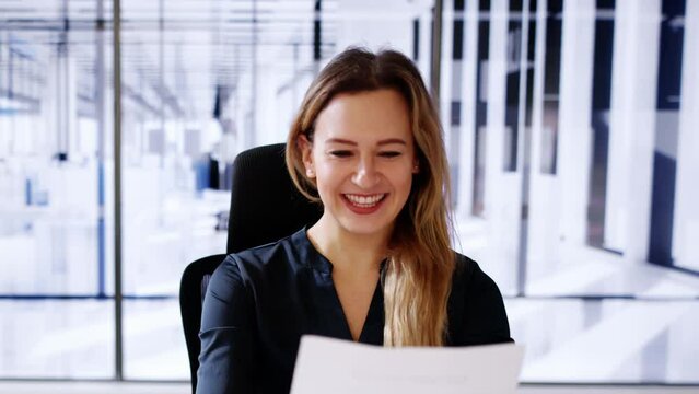 Happy Woman Reading Good News Letter