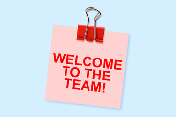 WELCOME TO THE TEAM - Concept with text against a paper label with copy space