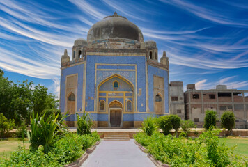 Impressive Islamic Architecture, Central Dome Mausoleum, Ornate Tile Work, Urban Setting, Blue Sky