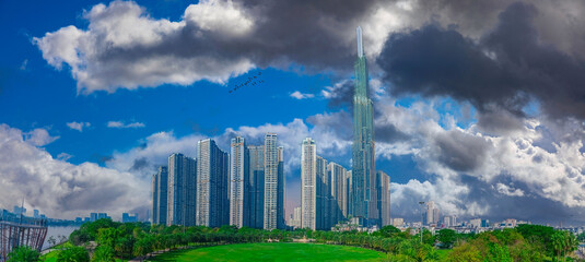 Panoramic City Skyline with Futuristic Tower and Lush Park, Dynamic Sky, Urban Tranquility