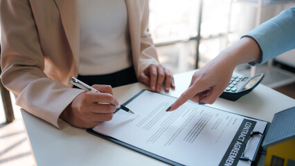 Customer discussing for the contract to buy home and insurance or loan real estate or property.