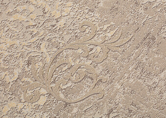 Background of beige wallpaper or plastered wall with a swirl pattern.