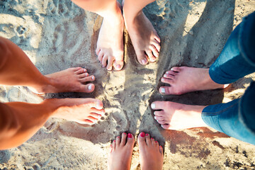 Top view image of feet of the female friends