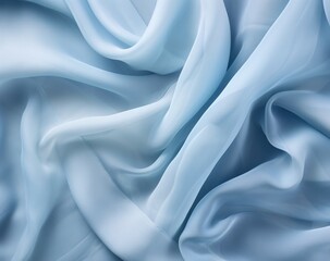 Fototapeta premium Folds of silk satin fabric lie beautifully on the table. Elegant pastel textile background for advertising goods and business.