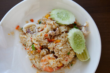 Directly above of fried rice with shrimp and squid on plate