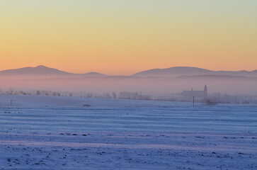 Naklejka premium beautiful cold January day, view of the sunrise over the mountains, Bolatice, Czech Landscape, 