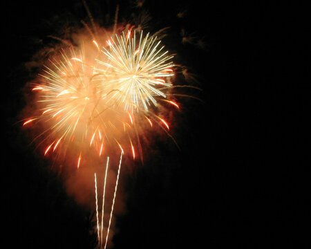 White and Red fireworks exploding against a dark sky