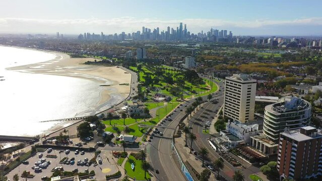 Ascending aerial footage of St Kilda, with Melbourne's CBD in the horizon