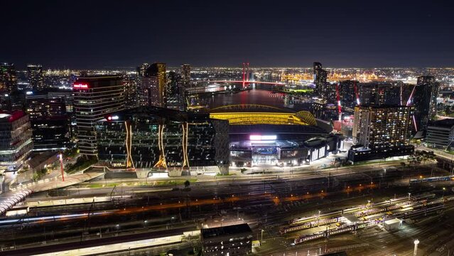 Night Timelapse from the Balcony of a skyscraper apartment overlooking the beautiful skyline behind Melbourne's Marvel Stadium