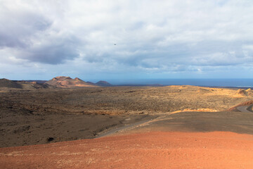Spectacular views of the Fire Mountains at Timanfaya National Park, this unique area consisting entirely of volcanic soils. A Mars-like volcanic landscape in a sea of ​​lava. Lanzarote, Canary Island