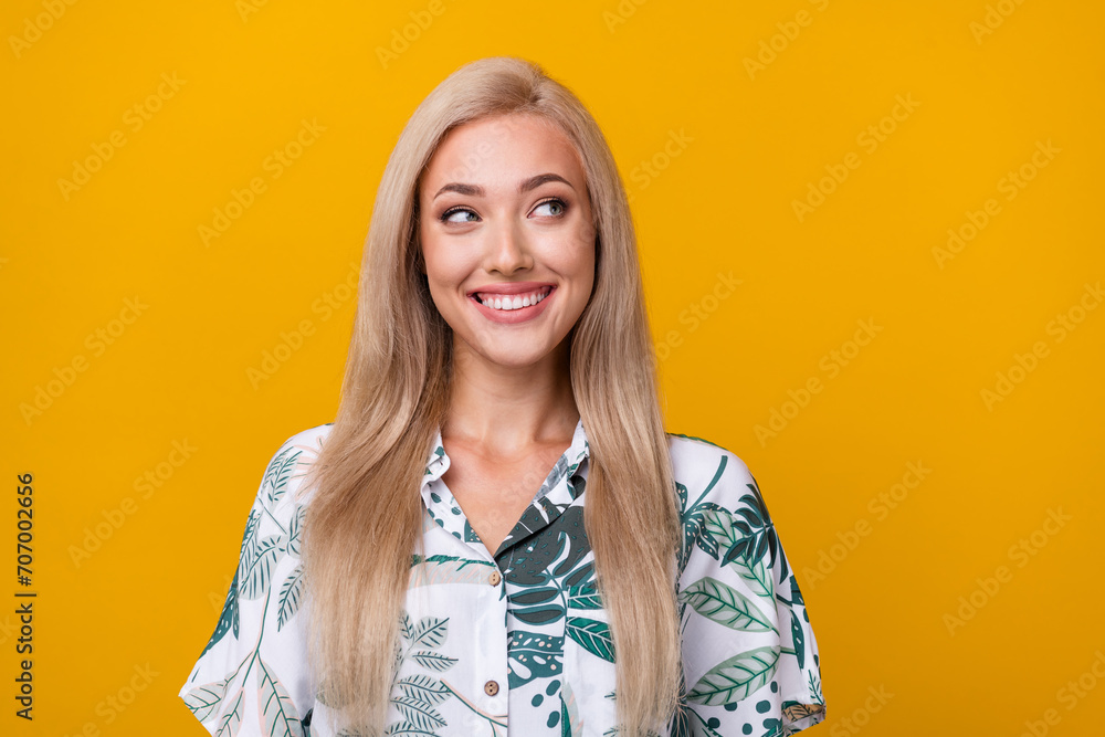 Poster Photo of toothy beaming woman with straight hairdo dressed print shirt look at discount empty space isolated on yellow color background