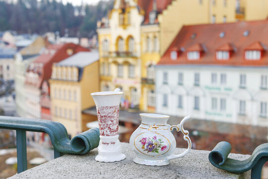 White cup for drinking therapeutic mineral water from natural hot springs.