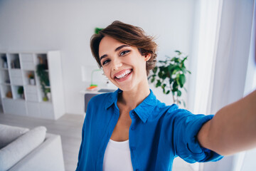 Portrait of cheerful lovely person toothy smile take selfie recording video demonstrate spacious...