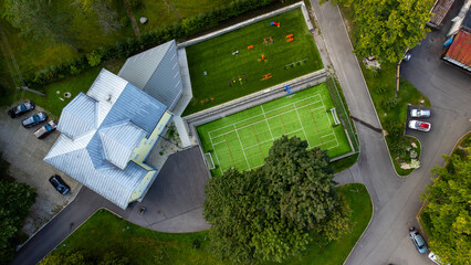 Aerial photo of school with football field. 