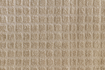 abstract background of beige terry towel texture close up