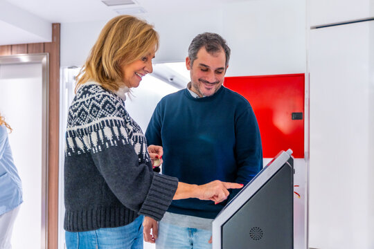 Patients scheduling appointments at the hospital using a modern machine