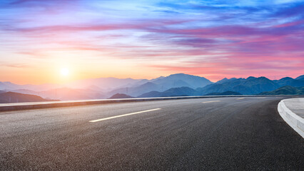 Asphalt highway road and mountain with sky clouds landscape at sunset - obrazy, fototapety, plakaty