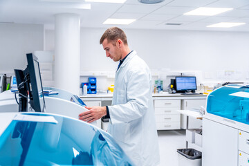 Doctor using innovative machine in a pathological anatomy laboratory