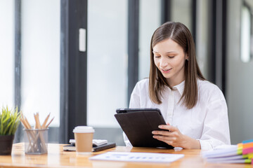 Young business hispanic woman work on laptop desk doing math finance on an office desk, tax, report, accounting, statistics, and analytical research concept