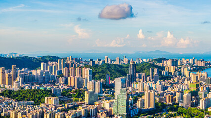 Aerial view of residential area buildings landscape by the sea in Zhuhai. Beautiful cityscape at sunset.