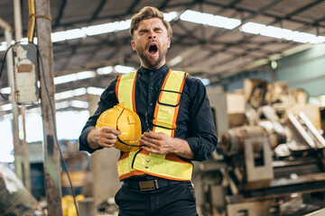lazy sleepy yawning engineer industry worker tired fatigue from hard work and sleep late or...
