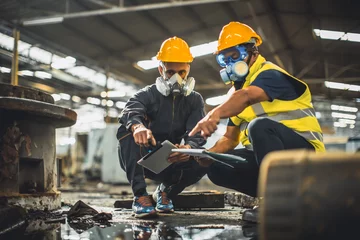 Fotobehang Toxic chemical gas leak safety team working cleaning in danger factory workshop environment contamination safety and protection © Quality Stock Arts