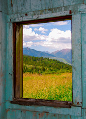 Scenic view of green hills seen through the open window