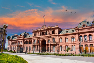 Casa Rosada at Sunrise or Sunset, Buenos Aires, Argentina, with Vibrant Sky and Walking Visitor