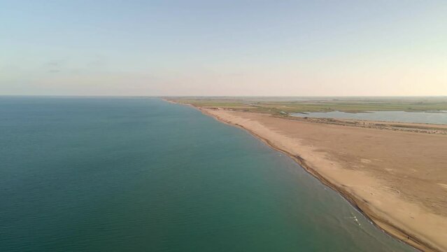 flight over expansive plains and along a long, scenic coastal strip