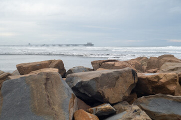 A seawall and a pier in Oceanside, California