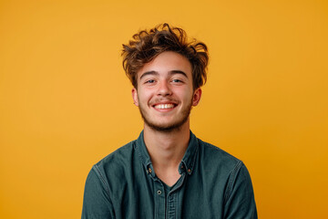 Obraz premium Fashion young man in studio giving pose on isolated color background