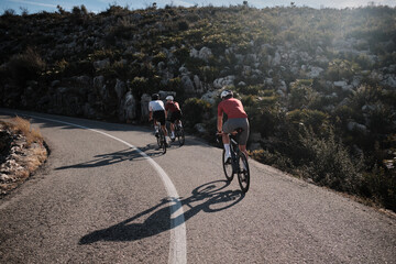Men cyclists training  together a road bicycle in Spanish mountains. Training for...
