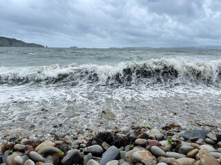 Vladivostok, waves in the Ussuri Bay near Patroclus Bay in cloudy summer weather
