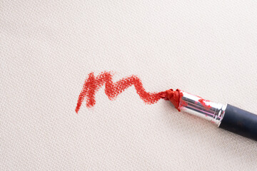 Dirty stain of lipstick on the couch or sofa. top view.