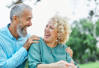 woman man couple happy together hug bonding mature mid middle age aged park outdoor talking leisure fun smiling love old nature wife happiness lifestyle people adult caucasian husband togetherness - Powered by Adobe