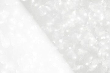 Abstract blurred white and silver bokeh background, festive season concept background, shiny...
