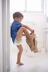Child, bathroom and toilet training for learning growth, milestone or hygiene. Male person, kid...
