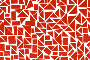 Red puzzle background. Geometric shapes pattern. Orange mosaic pieces background. Ceramic decoration texture. Puzzle look graphic design. Vibrant color texture. Red brick wall texture.