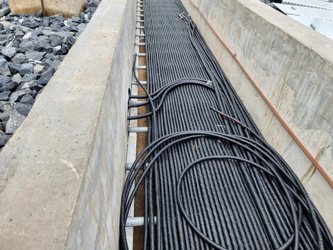 Construction of Substation: Control cable installation at the switchyard cable trench in the substation