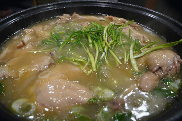 Whole chicken boiled with garlic and served with sea salt.  Sweet rice is boiled in the leftover...