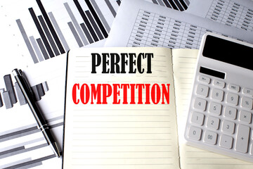 PERFECT COMPETITION text written on a notebook on chart and diagram