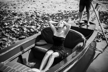 Concept of peaceful and relax. European lady in gondola resting - obrazy, fototapety, plakaty