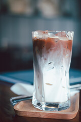 Refreshing summer drink concept. A glass of ice mocha show with beautiful texture and layers fresh milk and coffee.