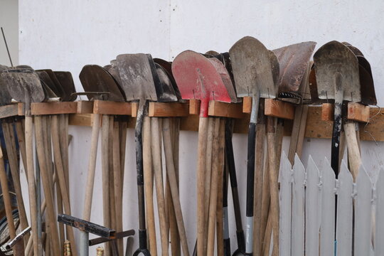 Earth digging tools, trowels and shovels. Photo of a deposit without people. Agriculture Tools. Farming.